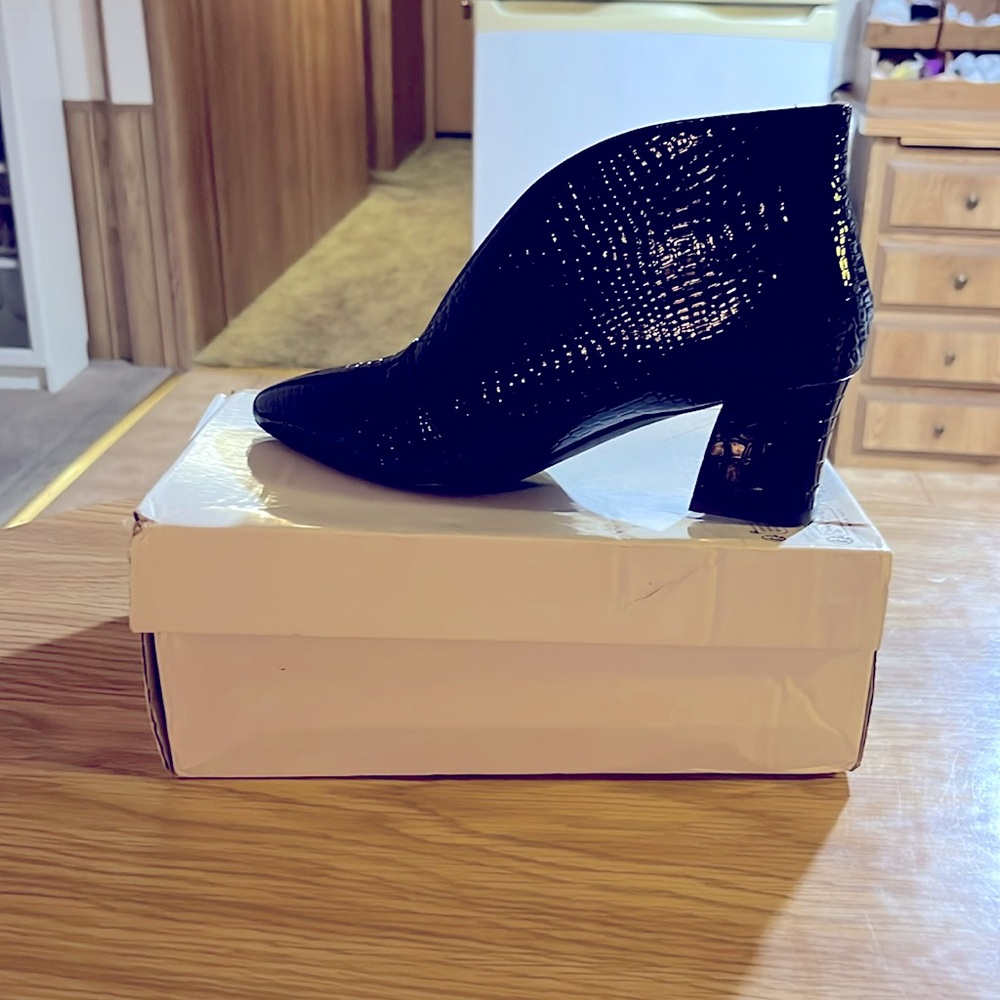 Brand new shiny black ankle boot